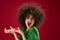 Positive young woman grimace afro hairstyle red lips fashion color background unaltered