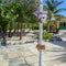 A post with arrows showing what direction and how many miles Half Moon Cay, Bahamas is from Fort Lauderdale, FL