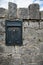 post box, embedded in a stone wall