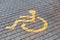 Post with disabled parking space and sign in front of parking bay in car park / Marked parking for people with special needs.