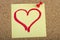 Post-it with heart shape drawn with lipstick