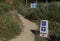 Post mark with the shell and yellow arrow, that guides the pilgrims along the Camino de Santiago, Spain.