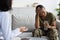 Post Military Depression. Upset Black Soldier Lady During Meeting With Psychotherapist