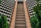 Post-Modern Investment House. concrete triangle high building with arc panels in Dar es Salaam, Tanzania