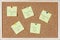 Post-it notes with weekdays and smileys sticked on corkboard