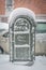 Post office mail box covered in snow on a cold snowy winter day in New York City