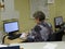 Post postage mail office operator secretary woman working type typing and register registering information on the computer