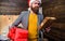 Post for santa claus. Man bearded hipster wear santa hat hold bunch of letters and gift box. Gifts delivery service