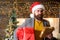 Post for santa claus. Man bearded hipster wear santa hat hold bunch of letters and gift box. Letter for santa claus. Man