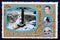 Post stamp Fujeira with rocket on launchpad and astronauts apollo 7 mission