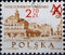 A post stamp printed in Poland showing a drawing of the Old Town Hall in Warsaw from the late 18th century