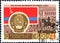 Post stamp printed in the USSR shows Coat of Arms, Flag and monument Kazakh SSR, serie `50 years of the Great October`. Philately