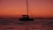 Post sunset sea with sailing ship