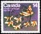 Postage stamp printed in Canada shows Dogteam and Dogsled ivory sculpture by Abraham Kingmeatook, Native Amerindians of Canada