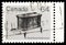 Postage stamp printed in Canada shows Wood stove, 64 Â¢ - Canadian cent, Heritage Artifacts serie, circa 1983