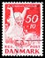 Postage stamp printed in Denmark shows Child in Meadow, National ChildrenÂ´s Welfare Association 1965 serie, circa 1965