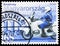 Postage stamp printed in Hungary shows Policeman on motorbike and emergency phone number, Police serie, circa 2003