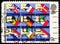 Postage stamp printed in United Kingdom shows Hands placing National Flags in Ballot Boxes, European Assembly Elections serie,