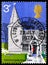 Postage stamp printed in United Kingdom shows St. Andrew\'s, Greensted-Juxta-Ongar, Essex, British Architecture, Village Churches