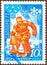 Postage stamp printed in the USSR with the image of a hockey player and the inscription in Russian `Sapporo, 72`