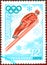 Postage stamp printed in the USSR with the image of a ski jumper and the inscription in Russian `Sapporo, 72`