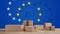 Postal packages in front of a creative Europe flag background 3d-illustration