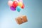 Postal service, shop delivery and online shopping, flying balloons carrying a parcel box, generative ai