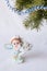 Postcard greetings happy New year, magic elf, fir branch, candle holder, Christmas gifts under the tree, the angel candle, on a wh