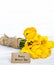 Postcard Mother`s Day and yellow tulips on wooden background
