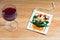 Postcard paper with flower and glass of red wine