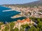 Postcard from Thassos. Aerial view of Limenaria Castle, now abandoned and Limenaria town and port