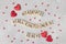 Postcard Valentine's Day, Wooden lettering Happy Valentine's Day, Red hearts on light gray background, Flat lay