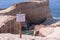 Posted sign on a edge of a cliff of Cape Kiwanda