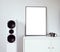 Poster Frame Mockup in white modern interior. Modern audio stereo system with white speakers on bureau in modern interior.