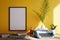 Poster framed mockup with yellow wall and typewriter on desk , 3d
