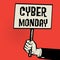 Poster in hand, business concept with text Cyber Monday