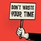 Poster in hand, business concept with text Don`t Waste Your Time