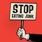 Poster in hand, business concept with text Stop Eating Junk