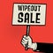 Poster in hand, business concept with text Wipeout Sale