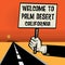 Poster in hand, text Welcome to Palm Desert, California