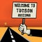 Poster in hand, text Welcome to Tucson, Arizona