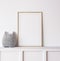 Poster mockup in minimal nursery design, wooden frame on white interior background