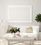 Poster, wall mockup in beige interior with white sofa, wooden table and plants, Scandinavian style