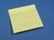 Postit over blue with copy space