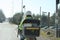 Postman at work on her scooter in the cold doing her job in delivering mail to citizens for public service on the streets of a