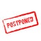 Postponed red rubber stamp isolated on white.