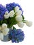 Posy of white tulips and blue hortensia flowers close up