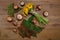 Posy of Yellow Dandelions,Forest Mushrooms,Green Leaves on the Wooden Table.Autumn Garden\'s Background