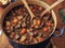 A pot of beef stew with a wooden spoon - generated by ai