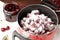 Pot with cherries and sugar on table, closeup. Making delicious jam